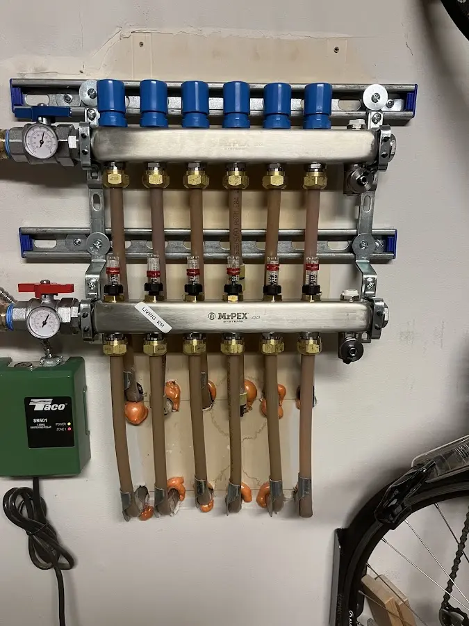 Plumber performing Water Heater Repair at a residential property in Pinehurst